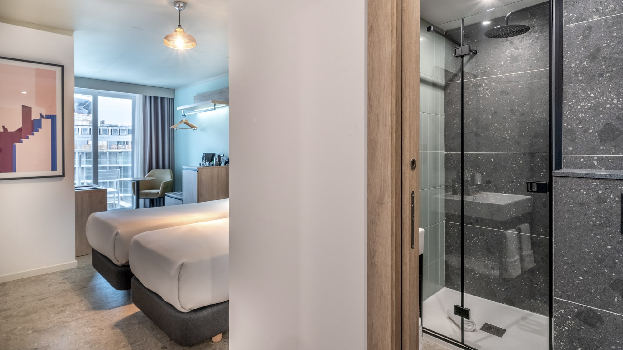 a room with two beds and a shower