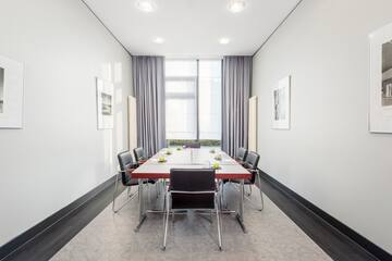 a room with a table and chairs