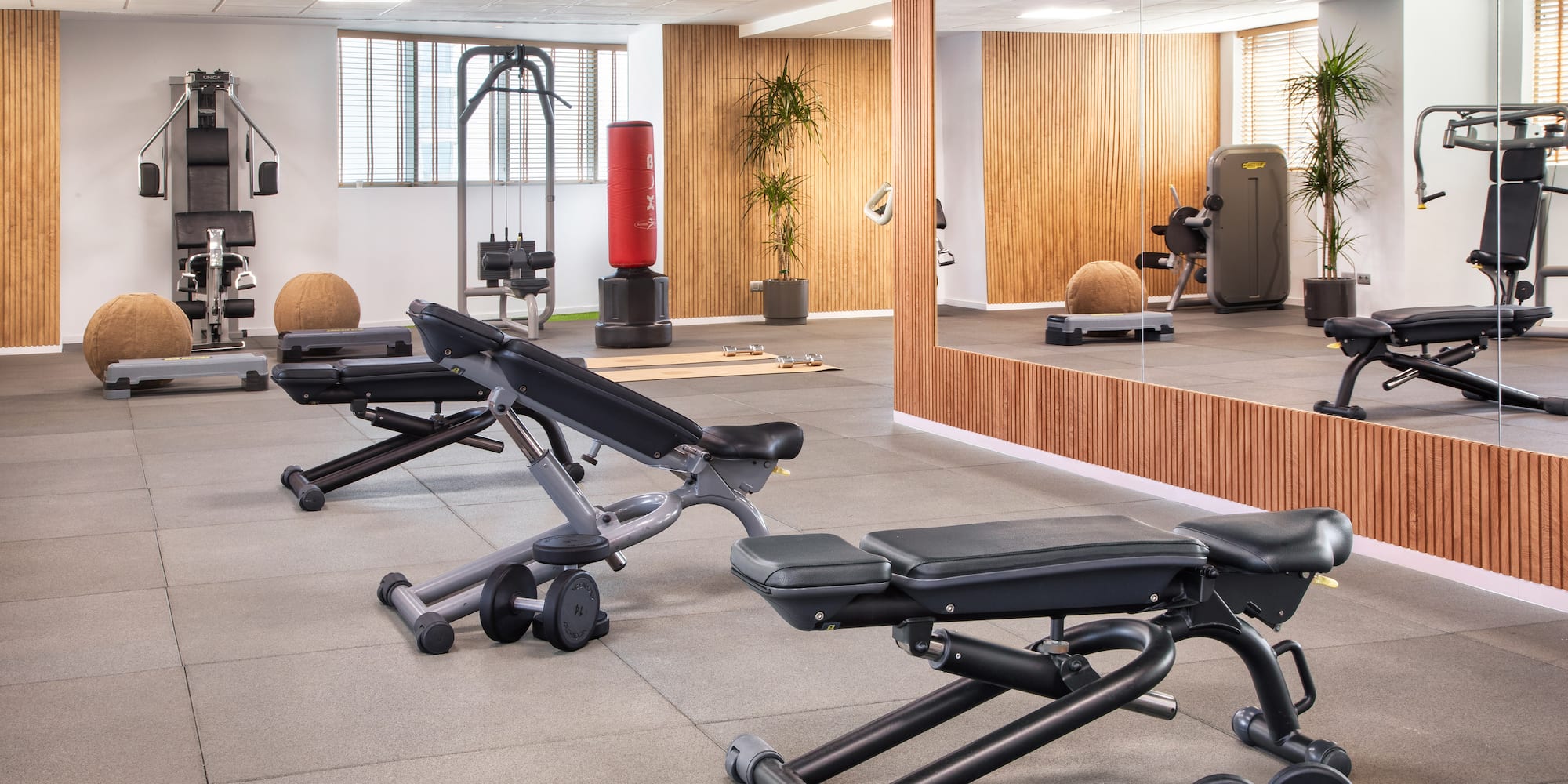 a room with a mirror and a wall