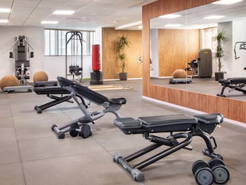 a room with a mirror and a wall