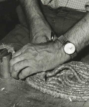 a man's hand with a watch