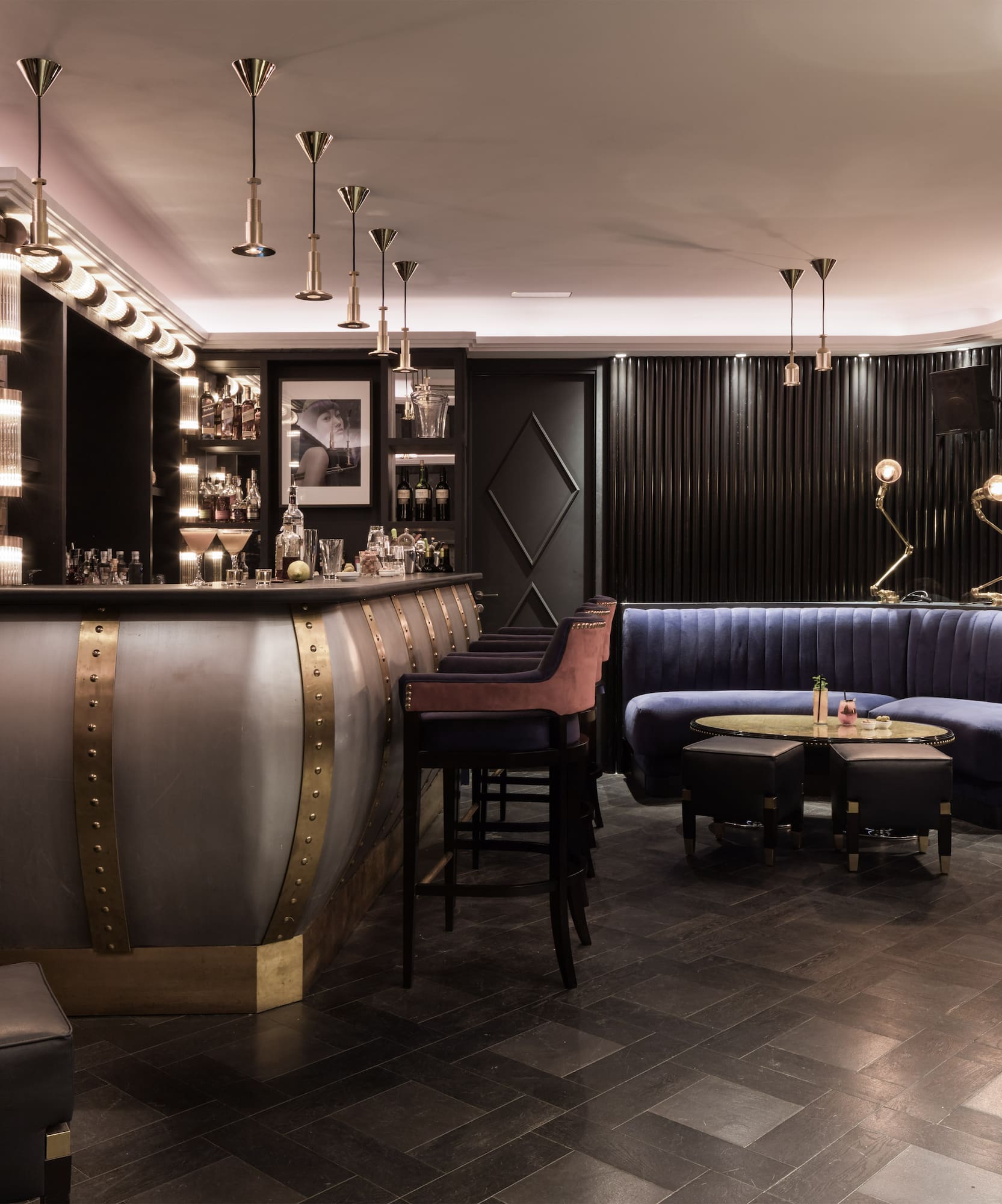 a bar with a blue couch and a blue sofa