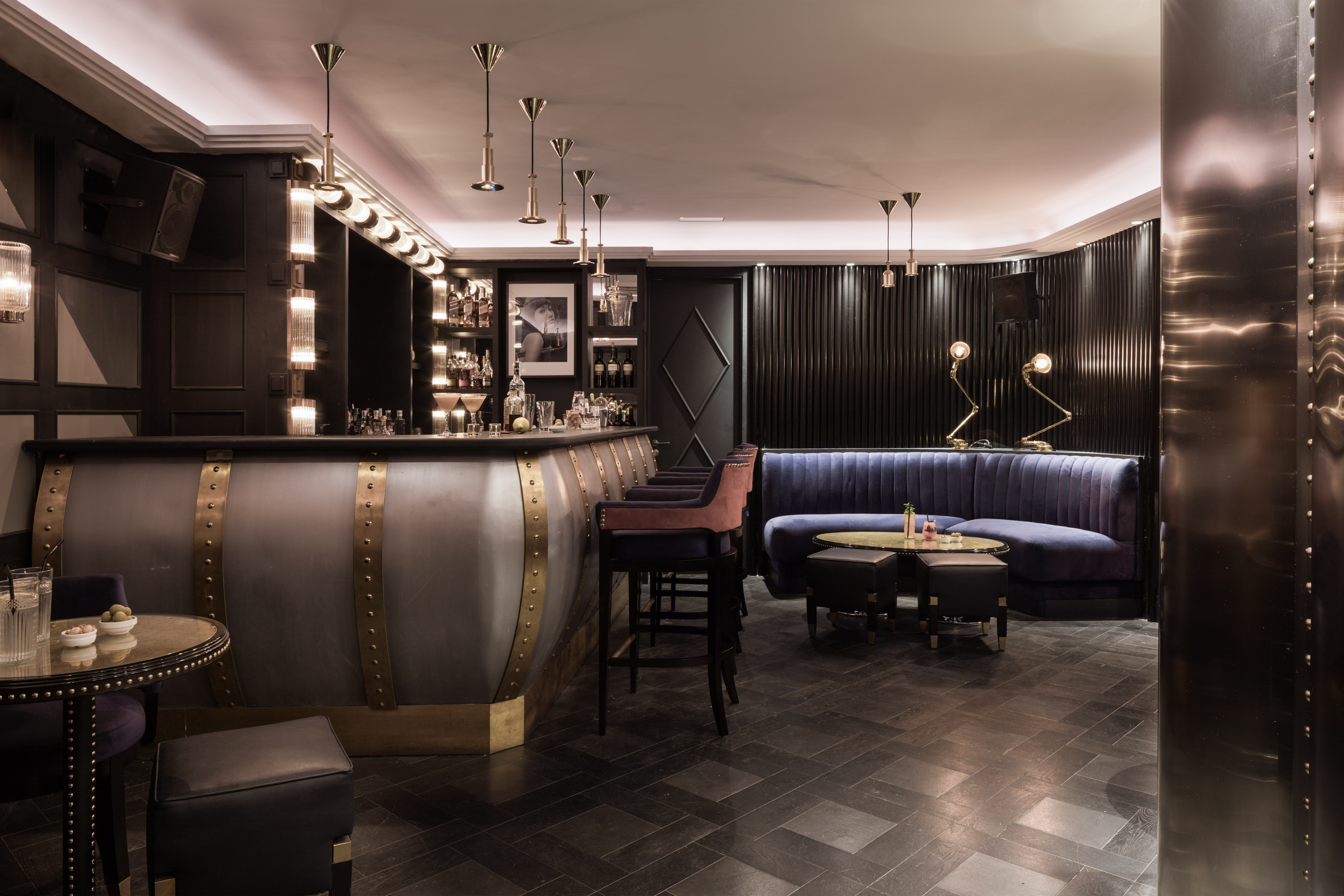 a bar with a blue couch and a blue sofa