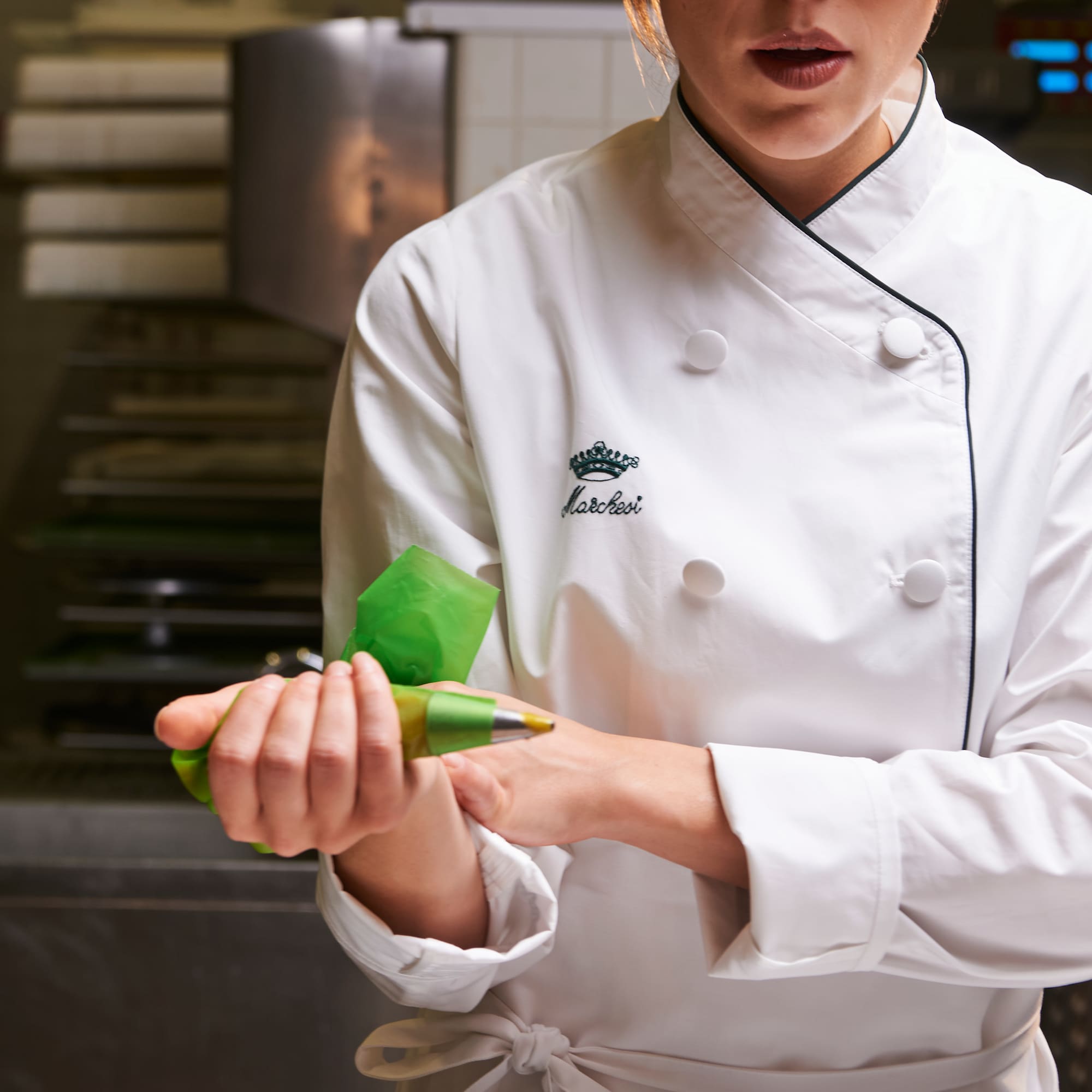 a chef holding a bag of food