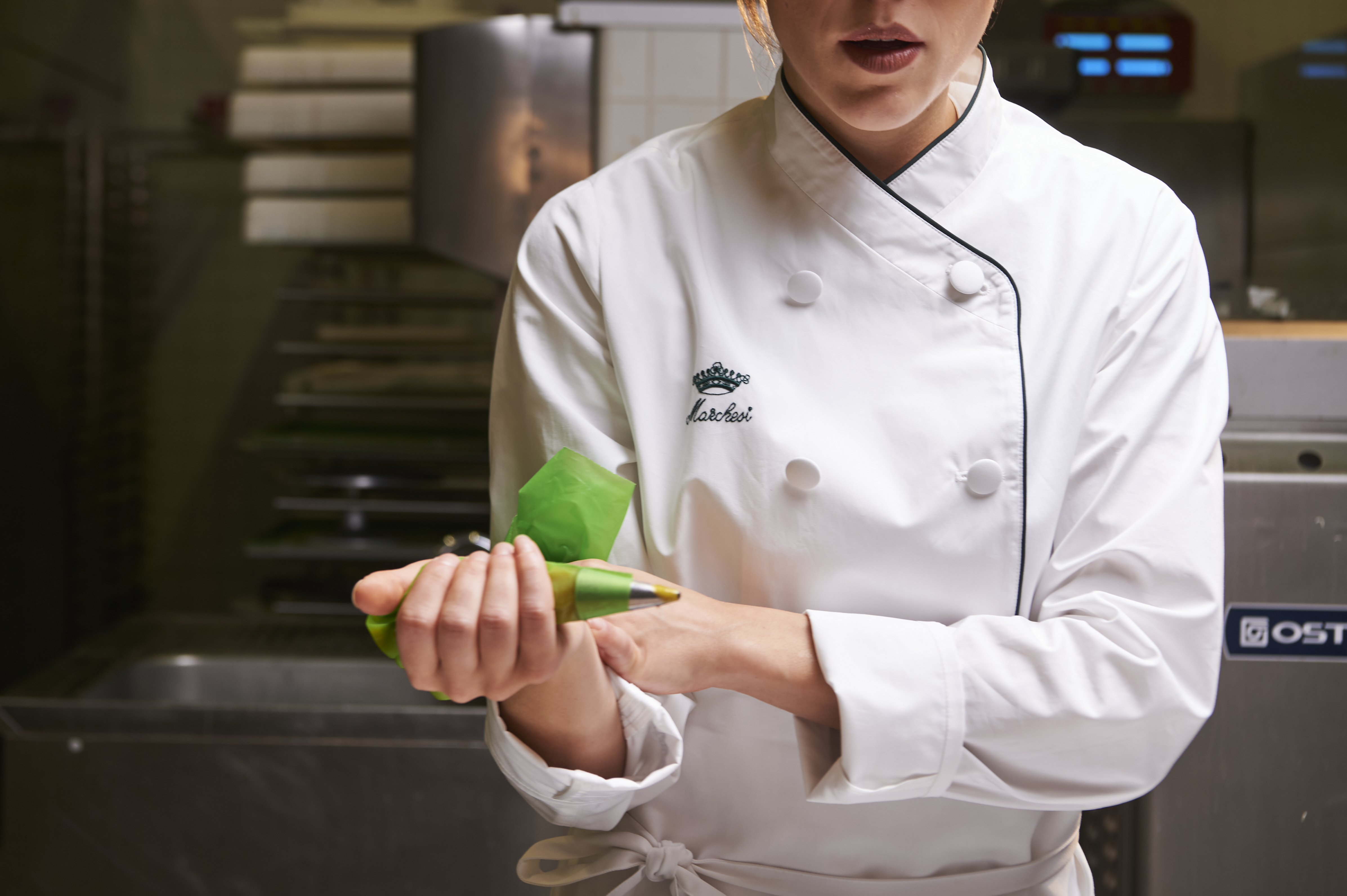 a chef holding a bag of food