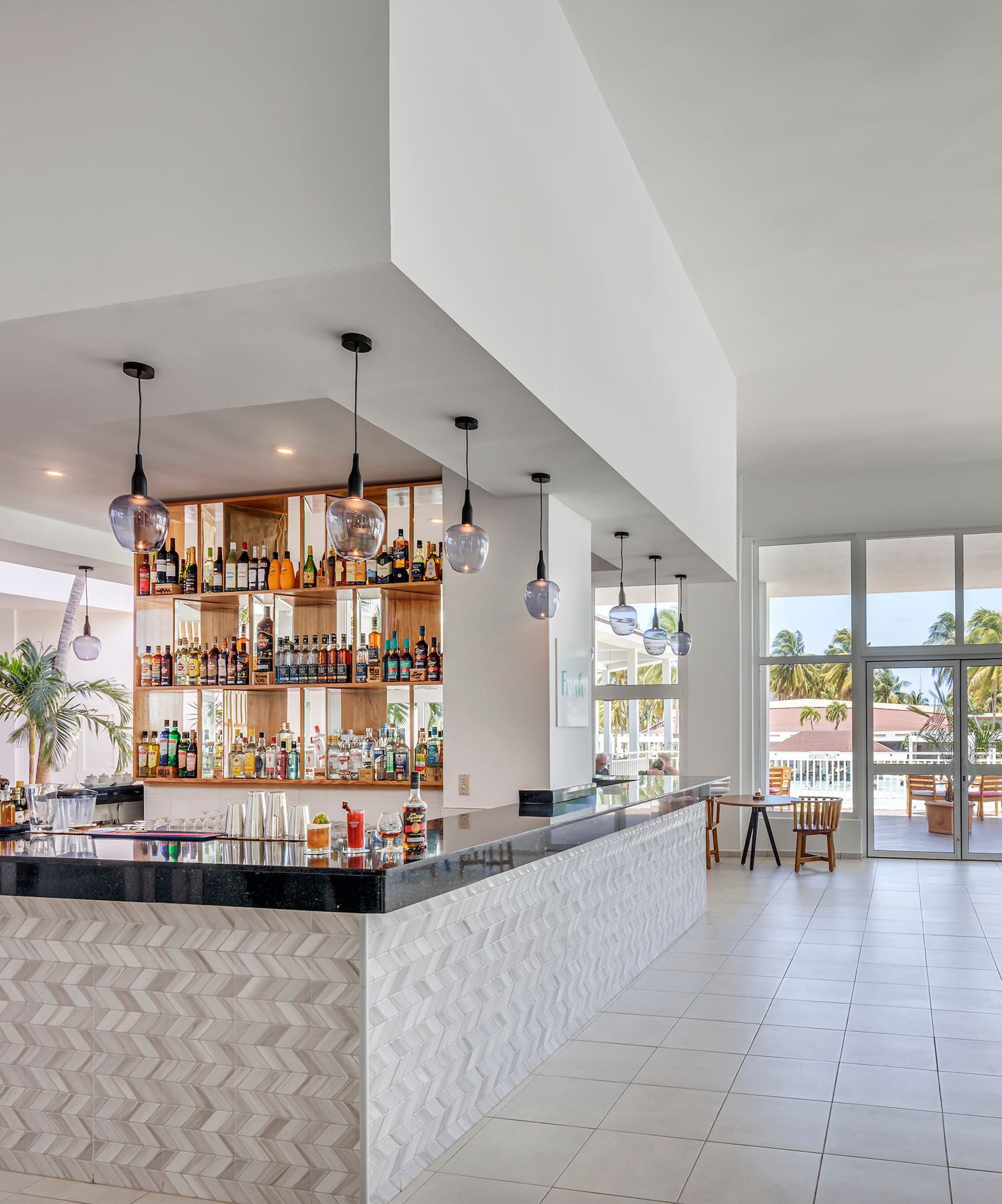 a bar with bottles on the counter