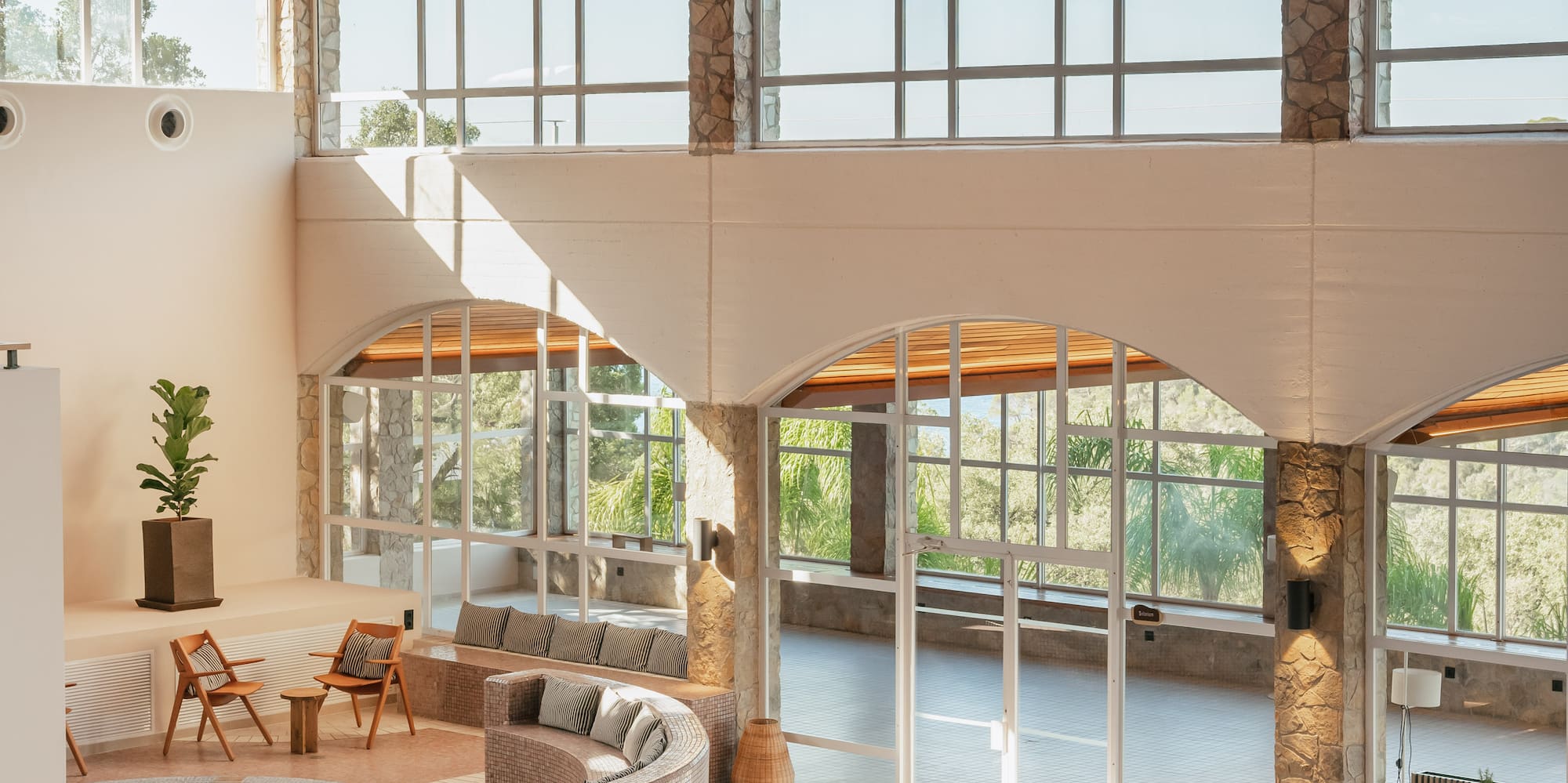 a room with a hot tub and a large pool