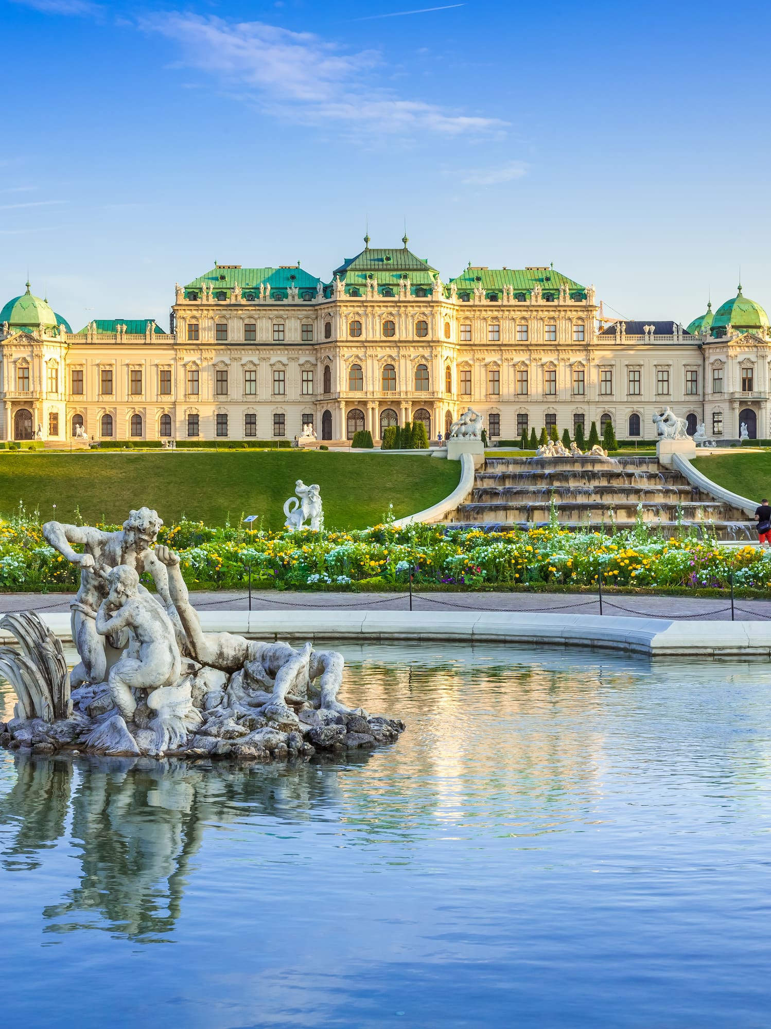 a fountain in front of a large building