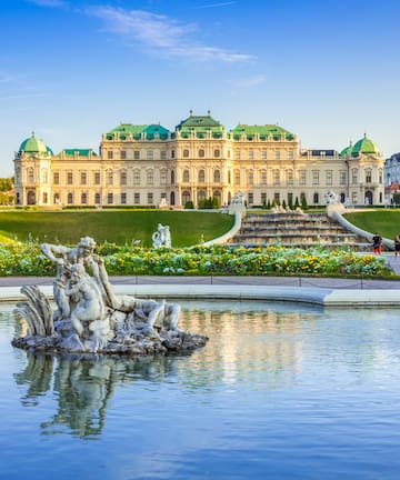 a fountain in front of a large building