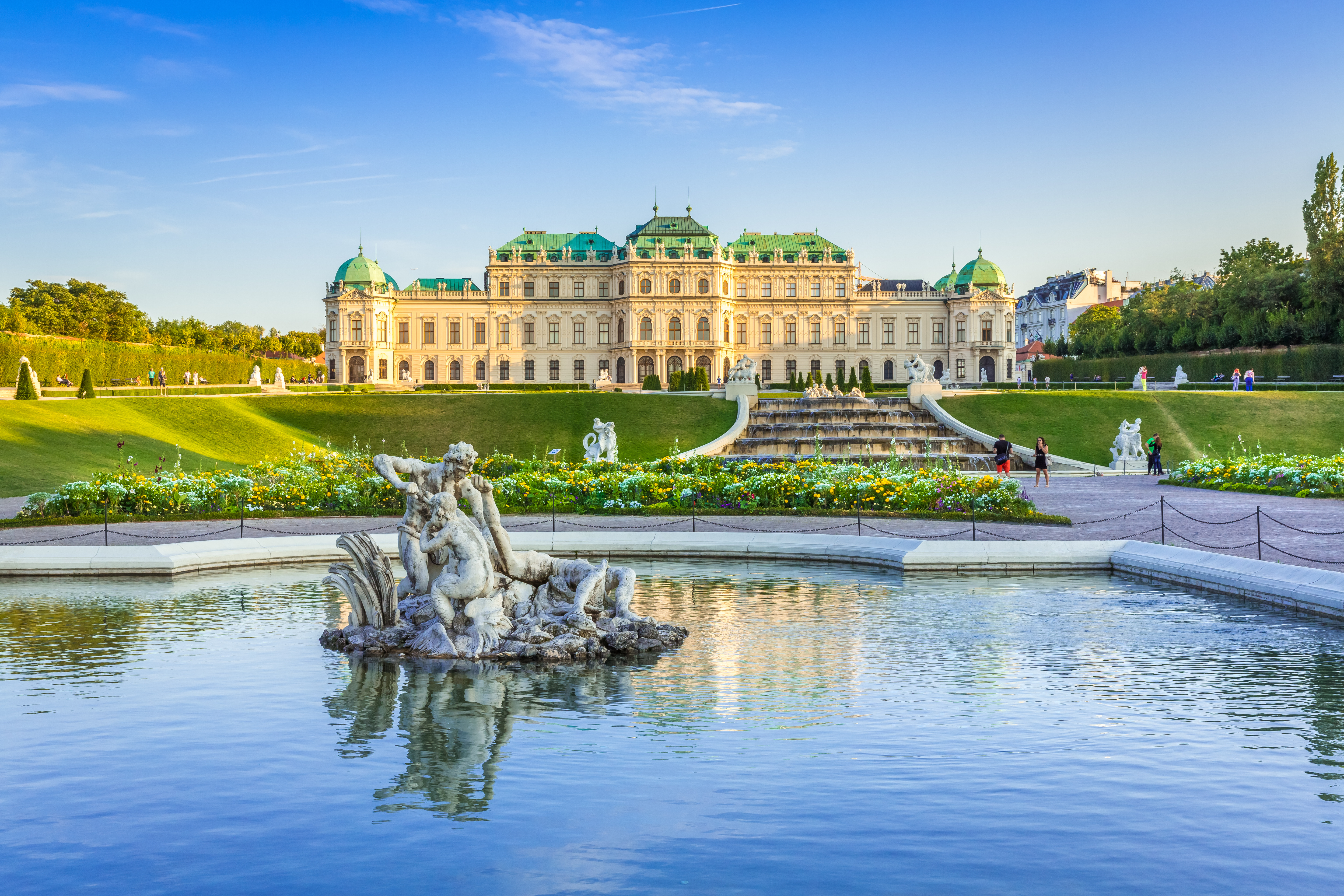 a fountain in front of a large building
