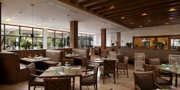 a restaurant with tables and chairs