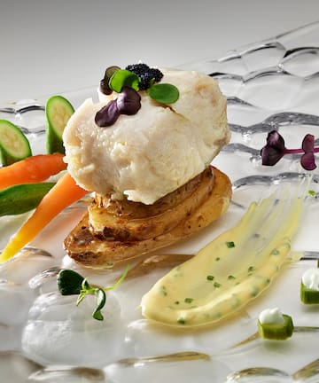 a plate of food on a white surface