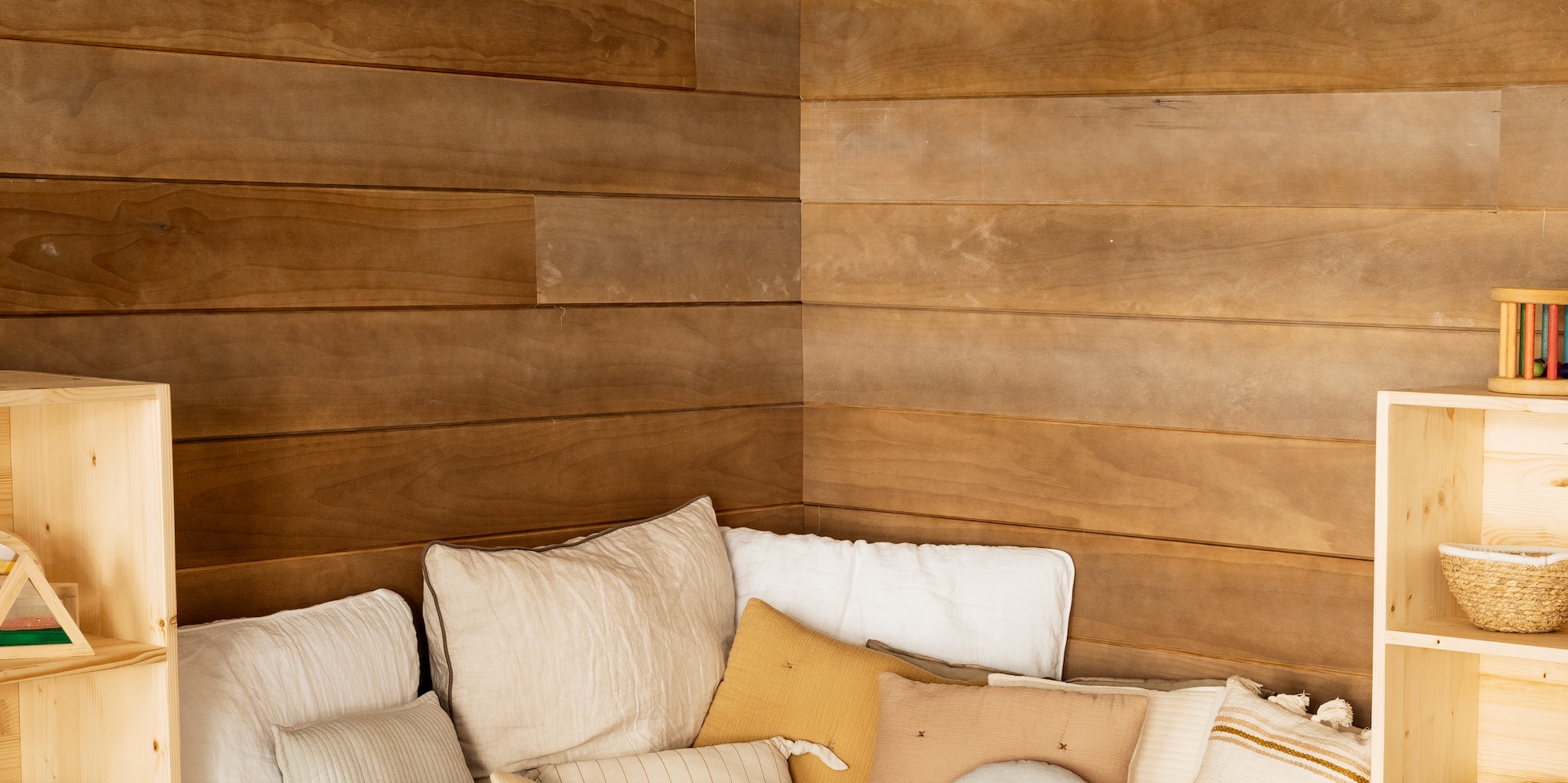 a room with a couch and shelves