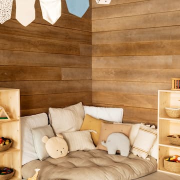 a room with a couch and shelves