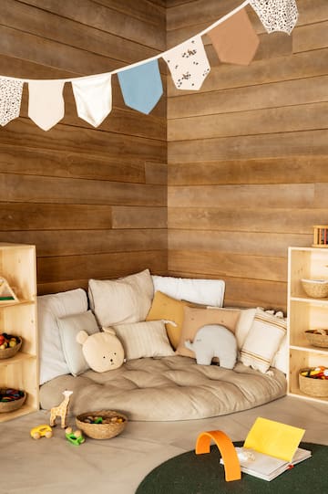 a room with a couch and shelves