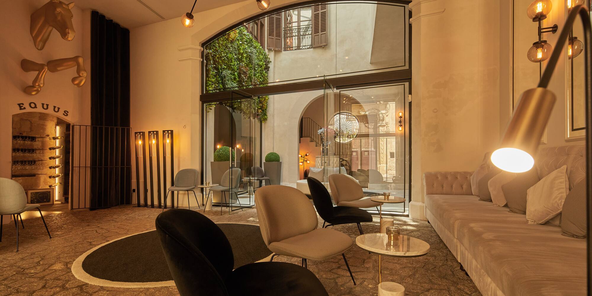 a room with a couch and chairs