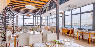 a restaurant with tables and chairs