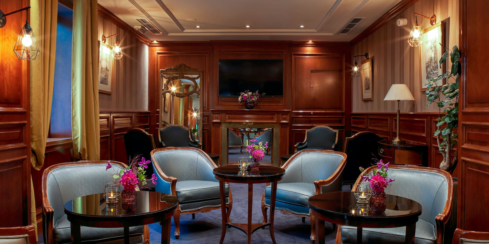 a room with a round table and chairs