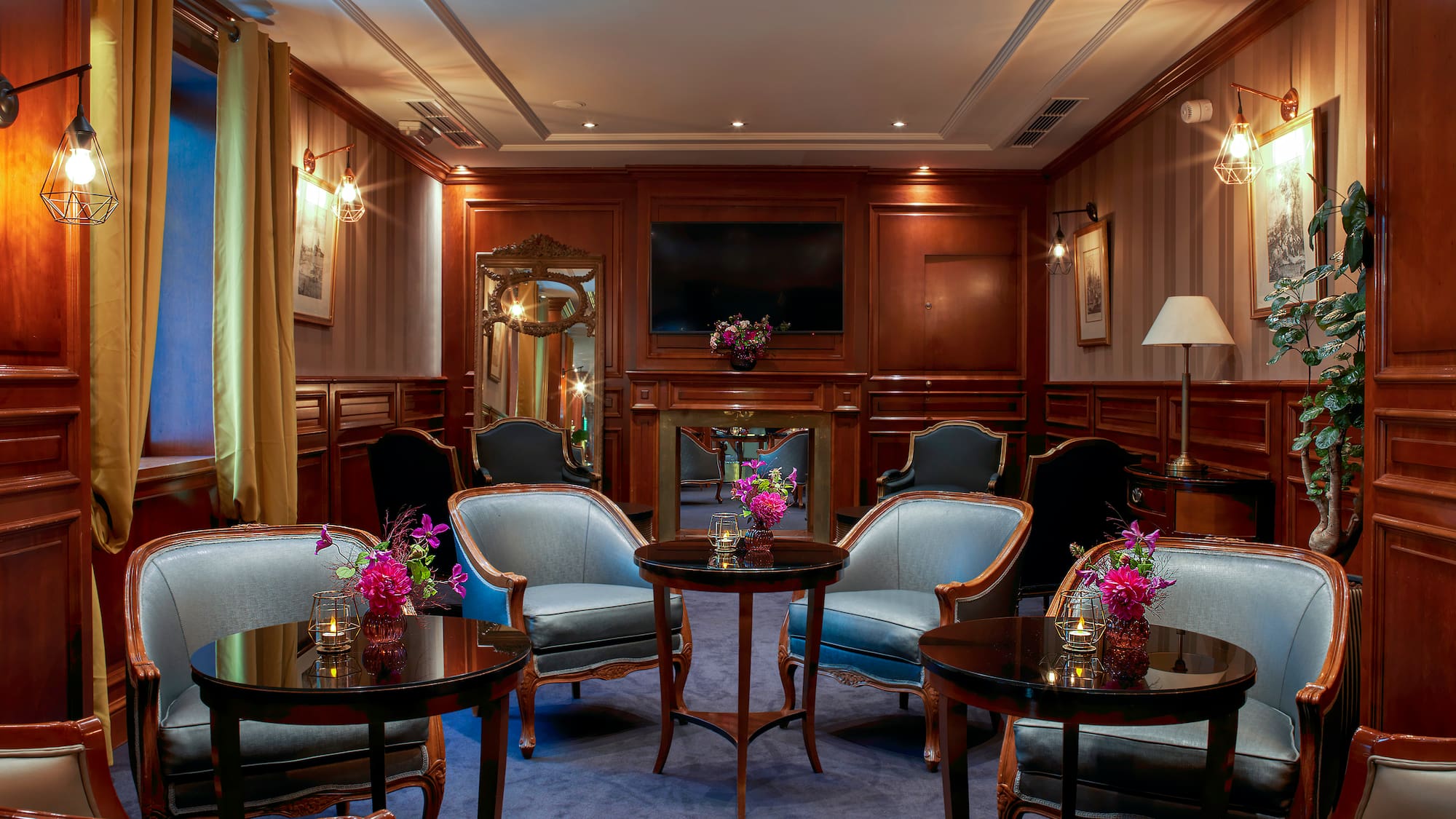 a room with a round table and chairs