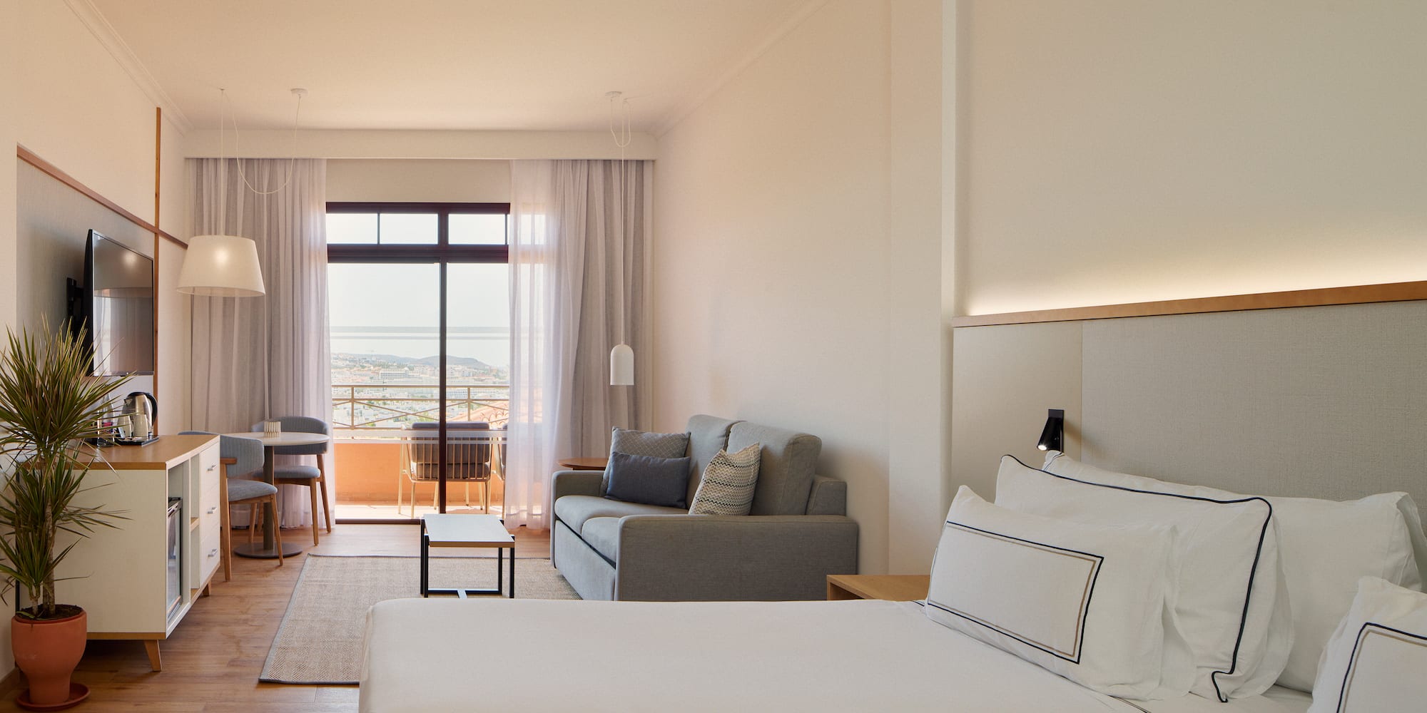 a room with two beds and a couch