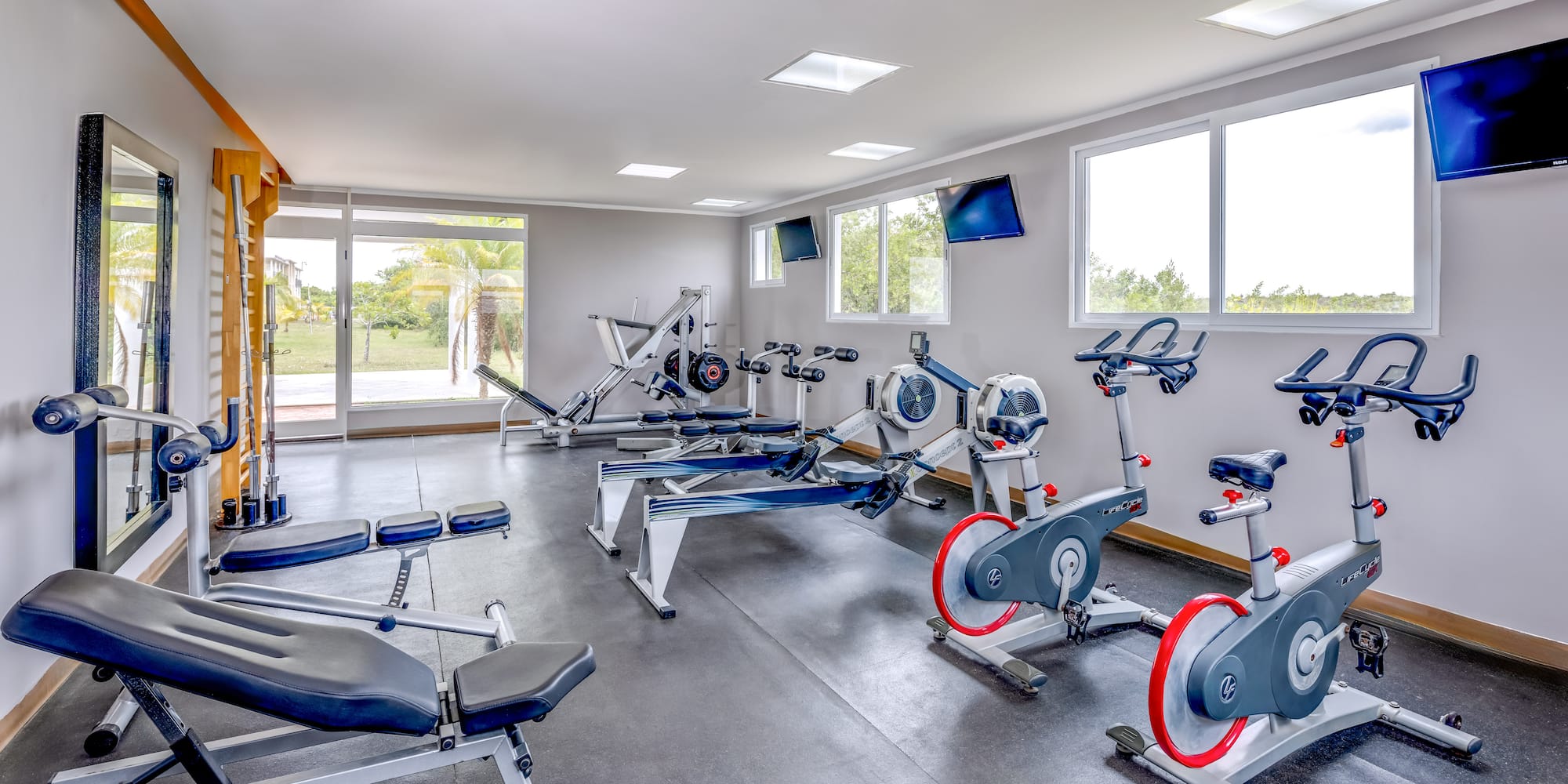 a room with exercise bikes and exercise machines