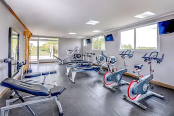 a room with exercise bikes and exercise machines
