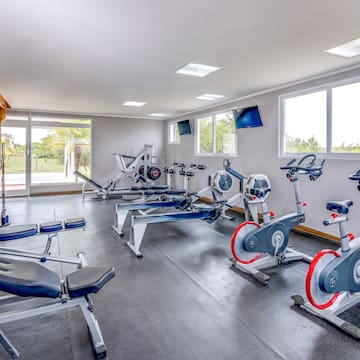 a room with exercise bikes and exercise machines