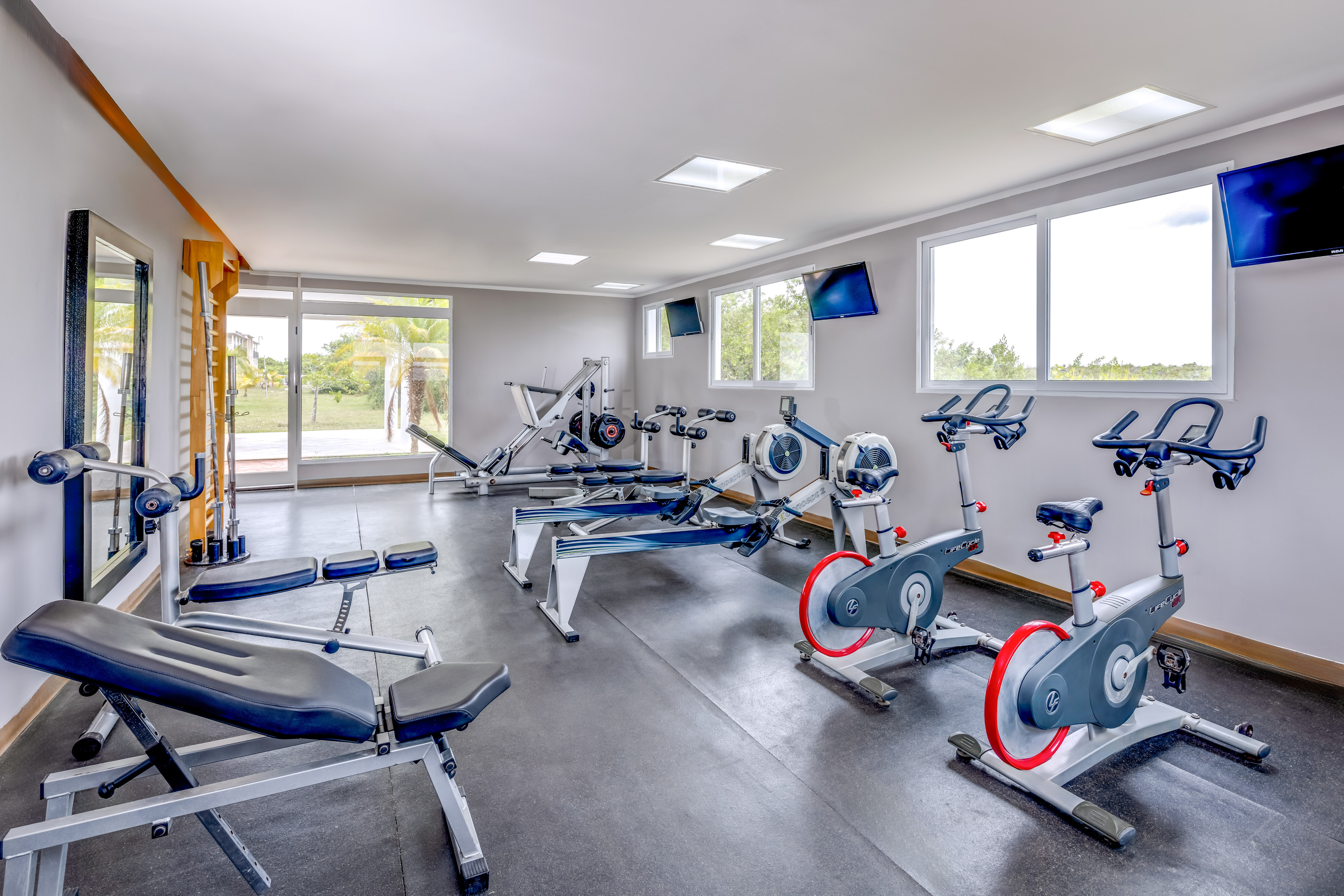 a room with exercise bikes and exercise machines
