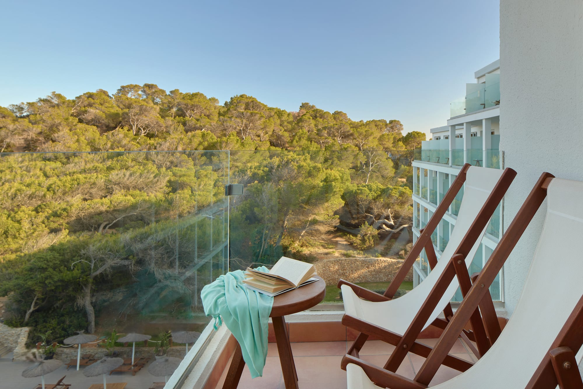 a chair and table with a book on it