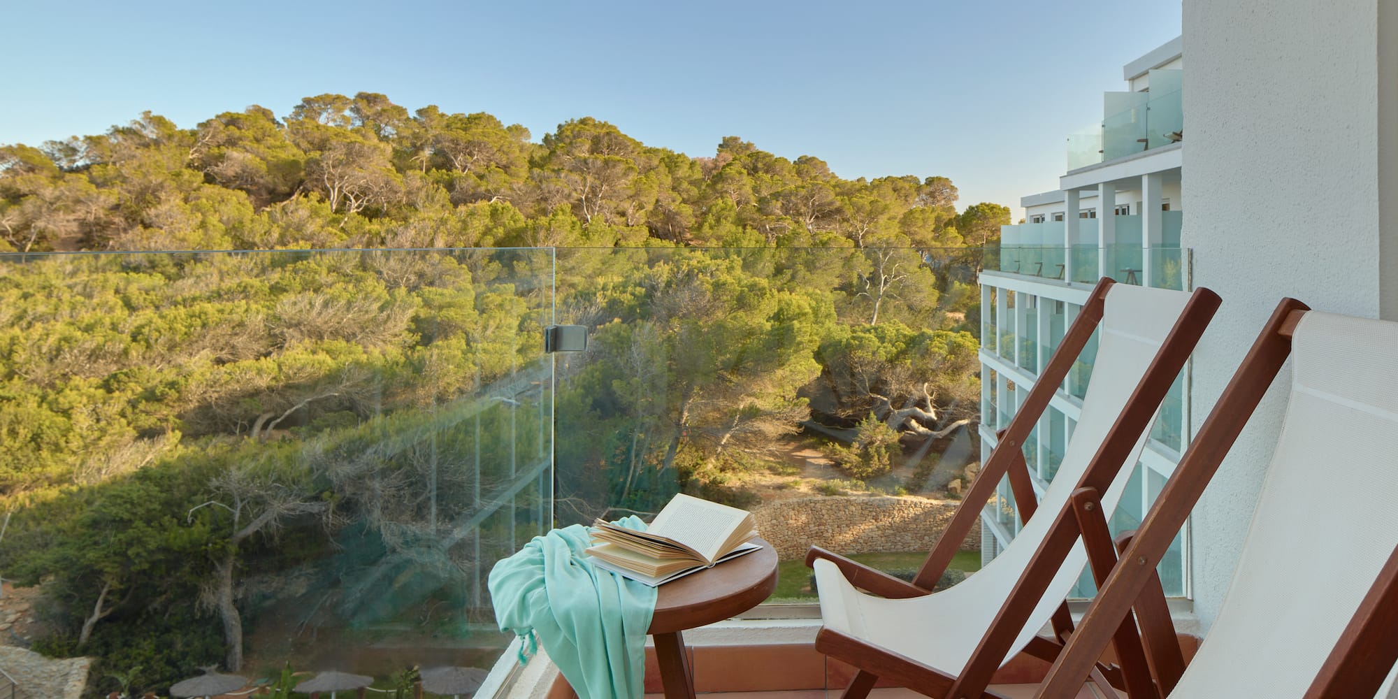 a chair and table with a book on it