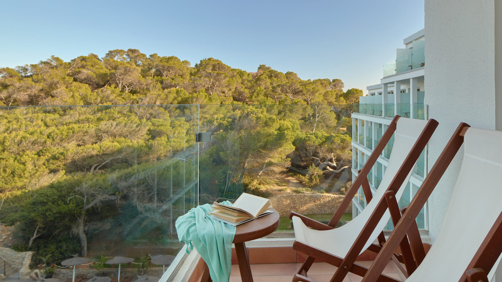 a chair and table with a book on it