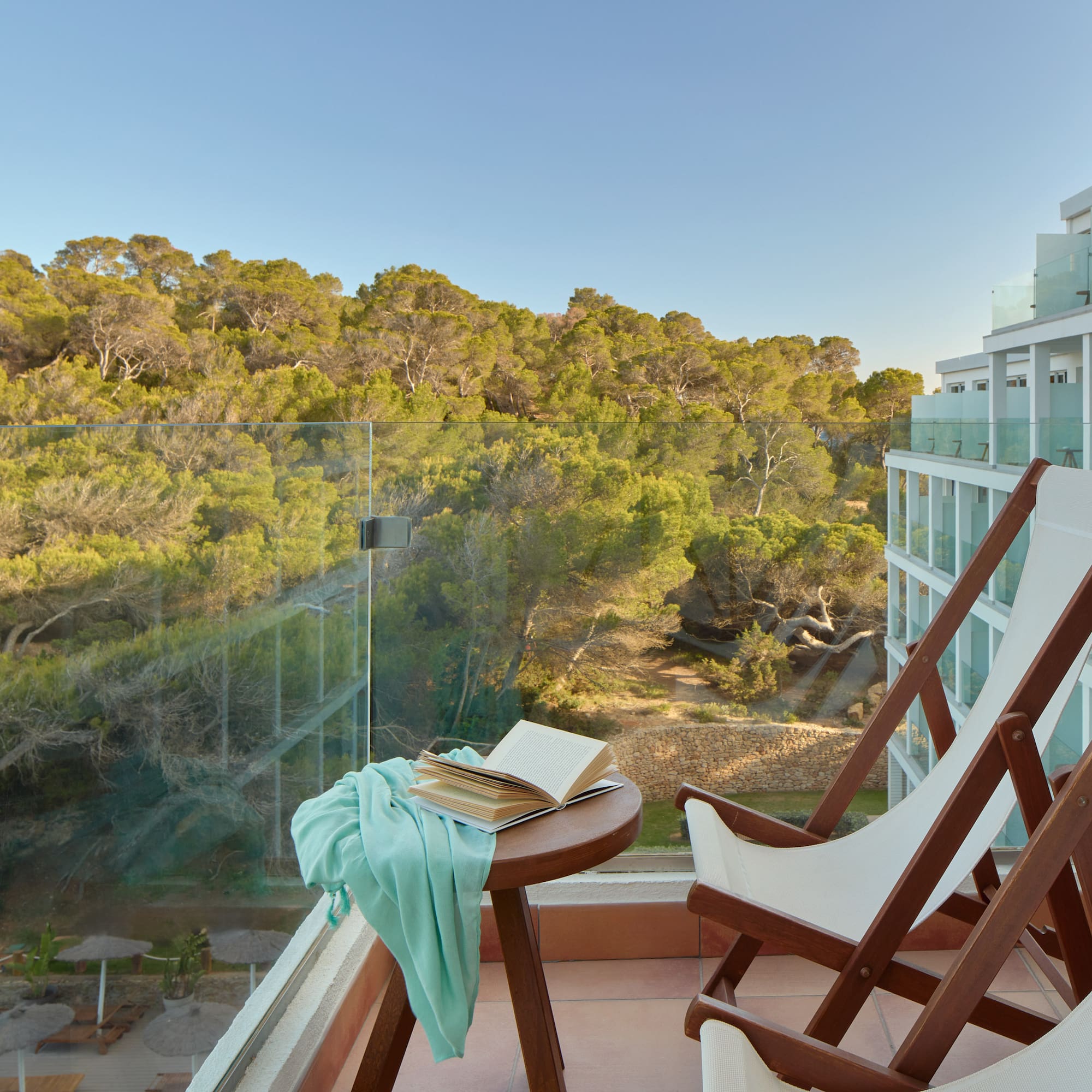 a chair and table with a book on it