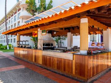 a outdoor bar with a grill