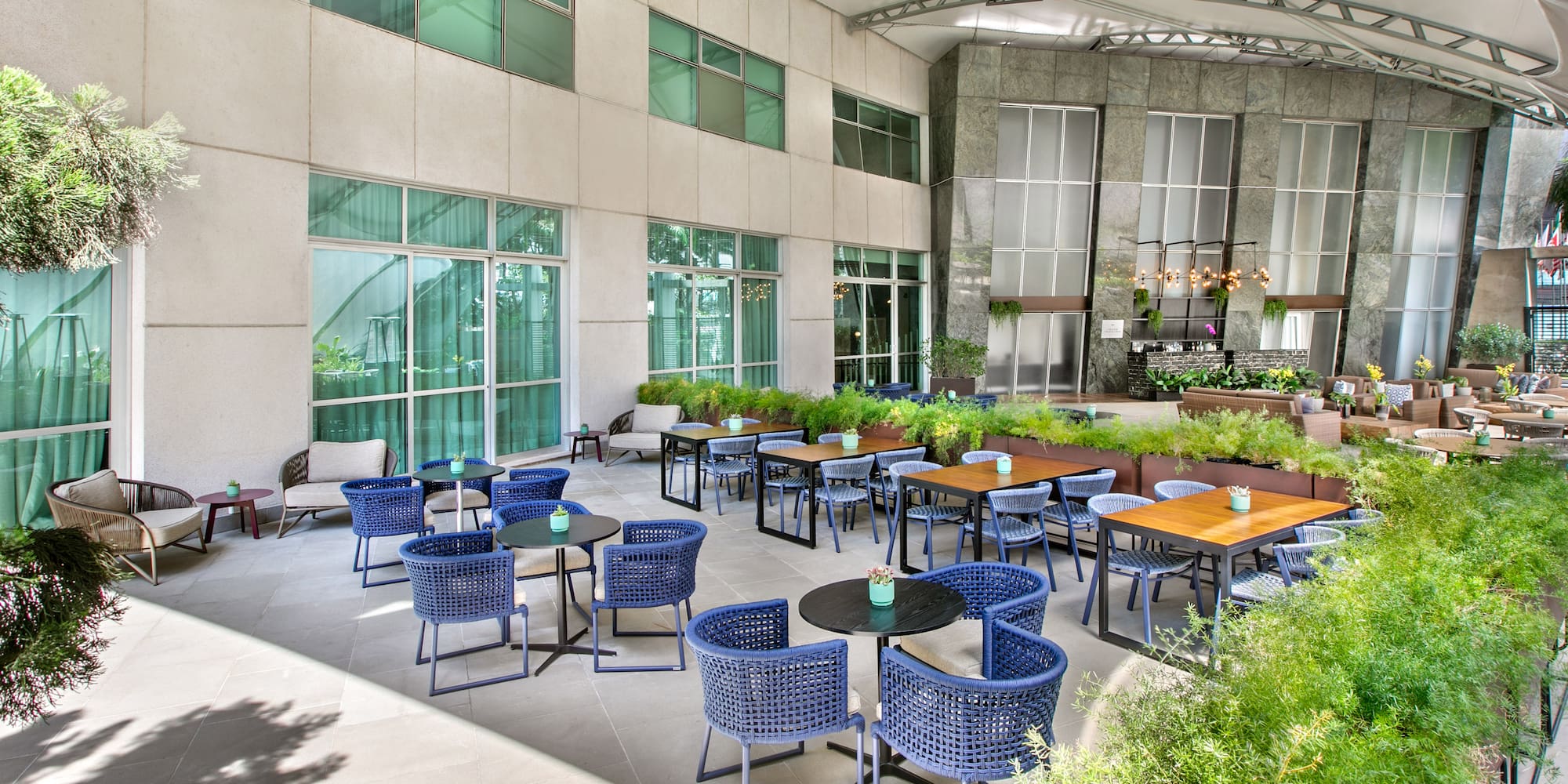 a patio with tables and chairs