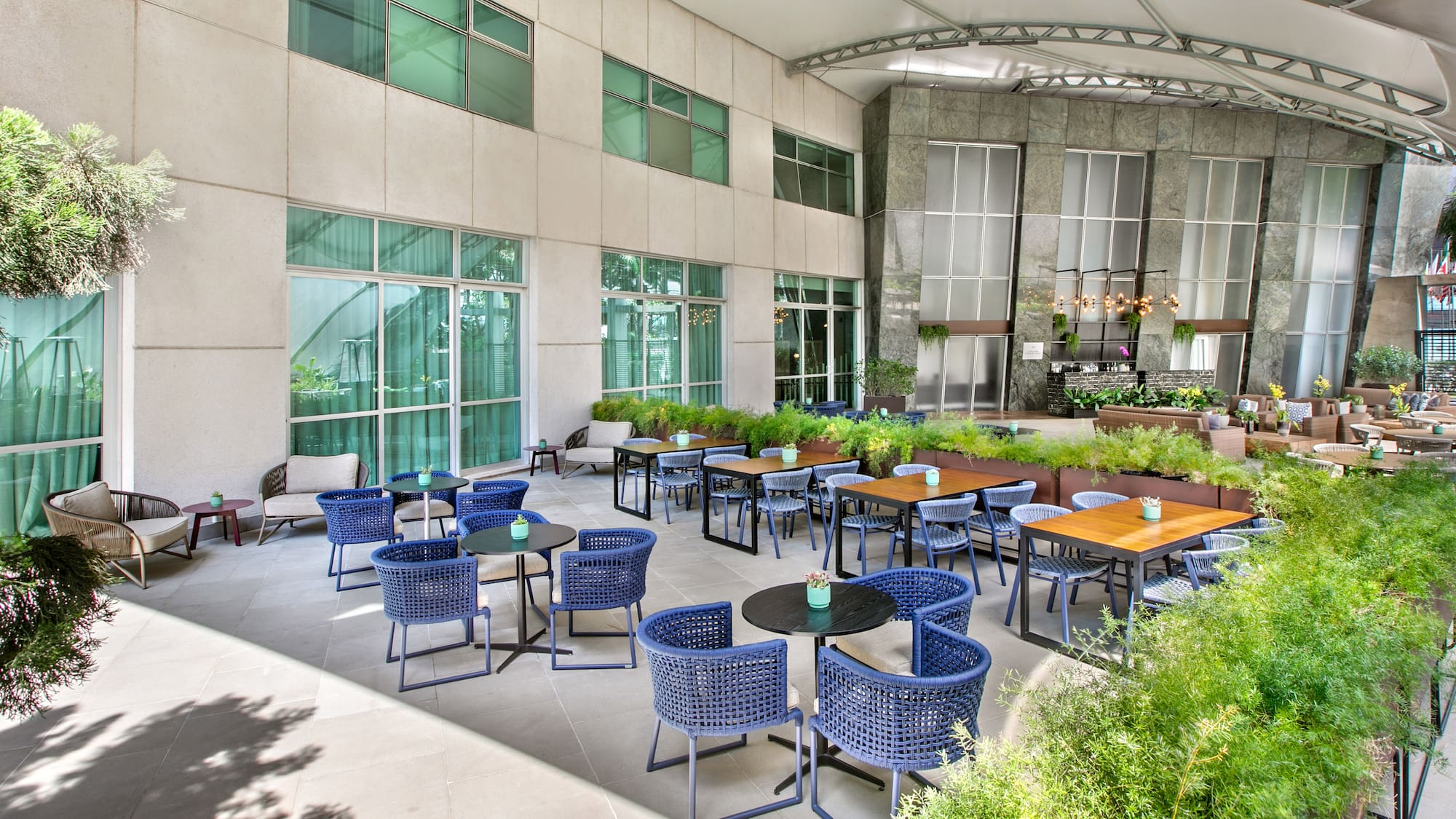 a patio with tables and chairs
