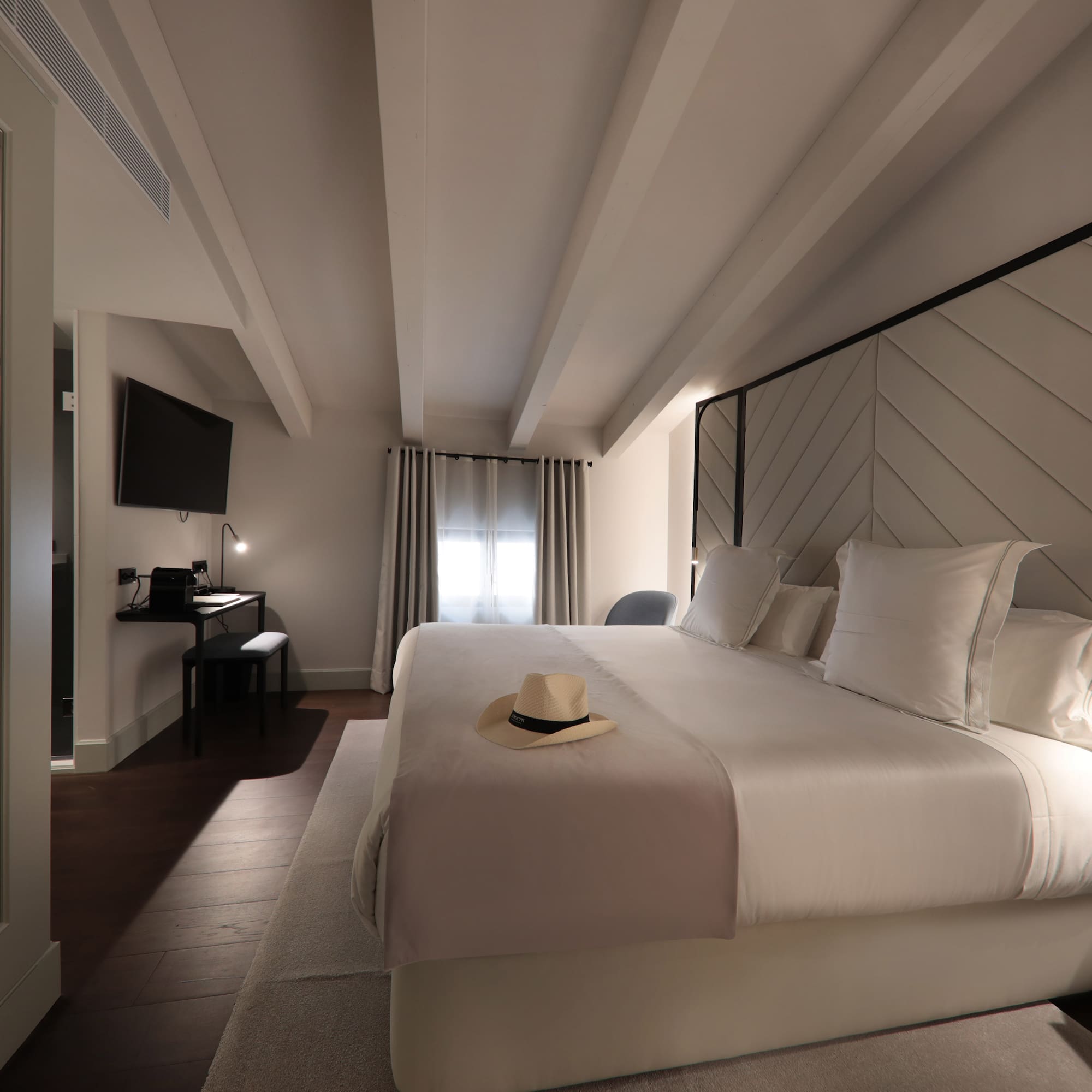 a bed with a hat on it