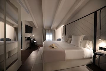 a bed with a hat on it