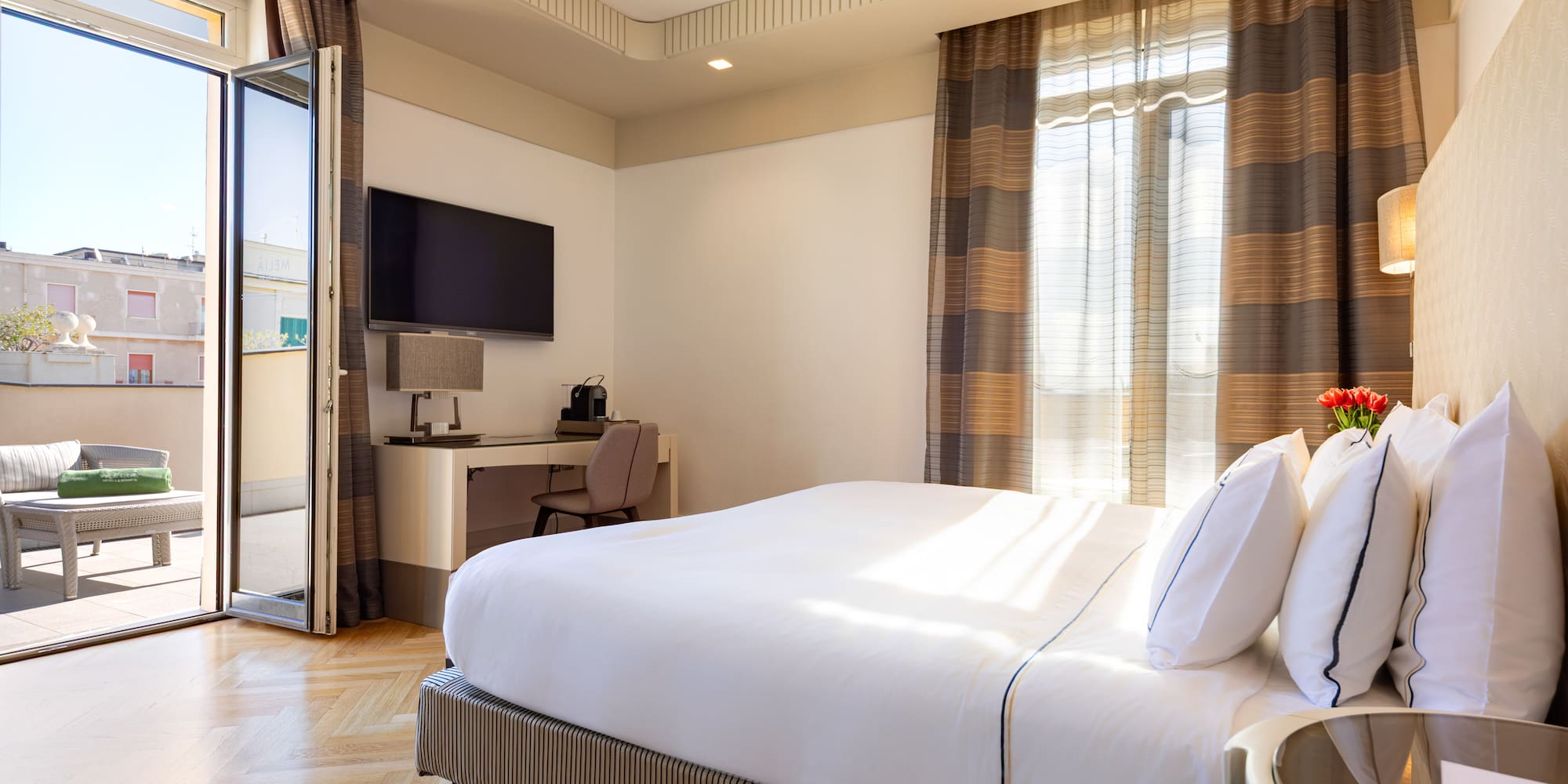 a bedroom with a bed and a desk