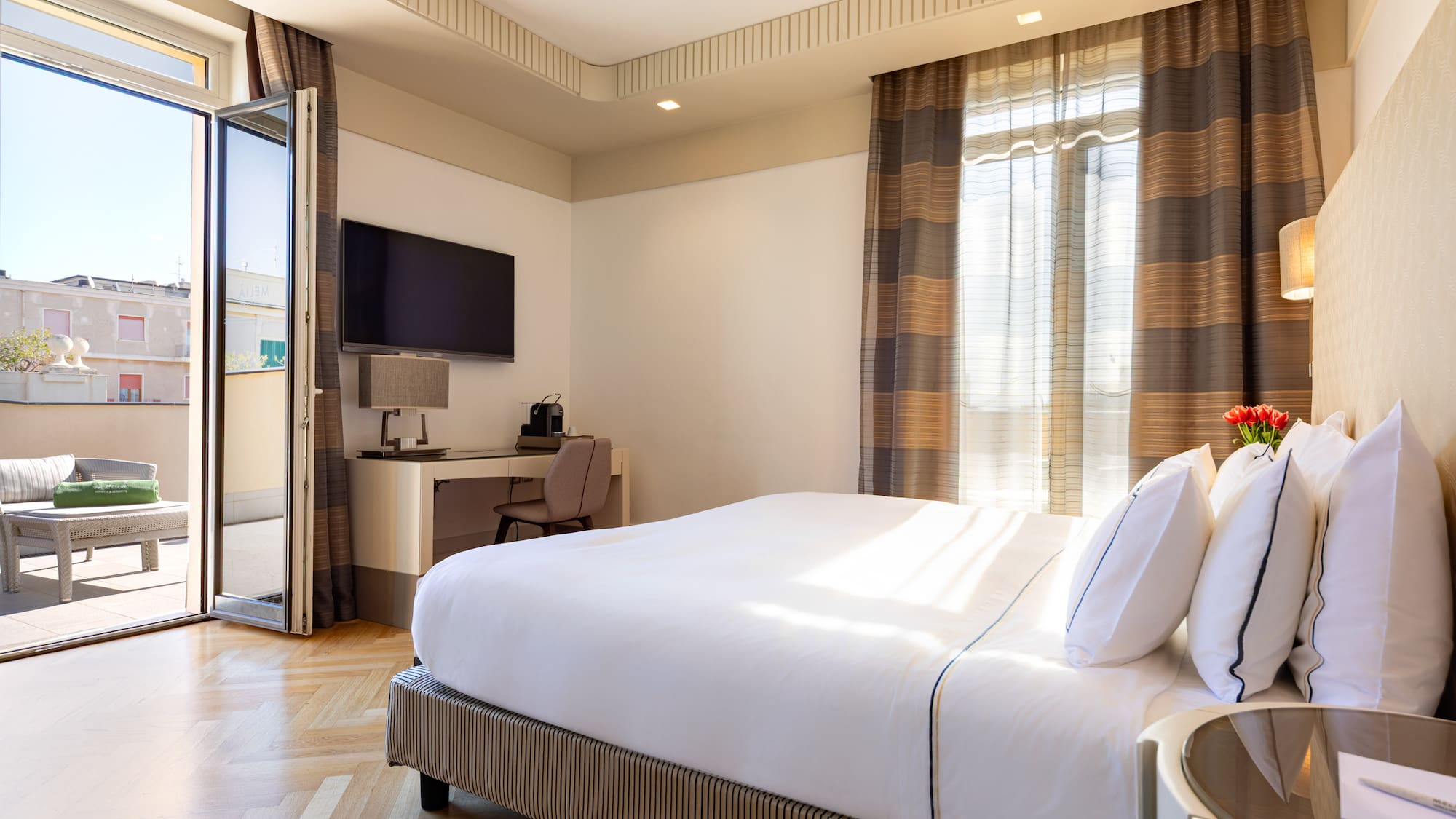 a bedroom with a bed and a desk