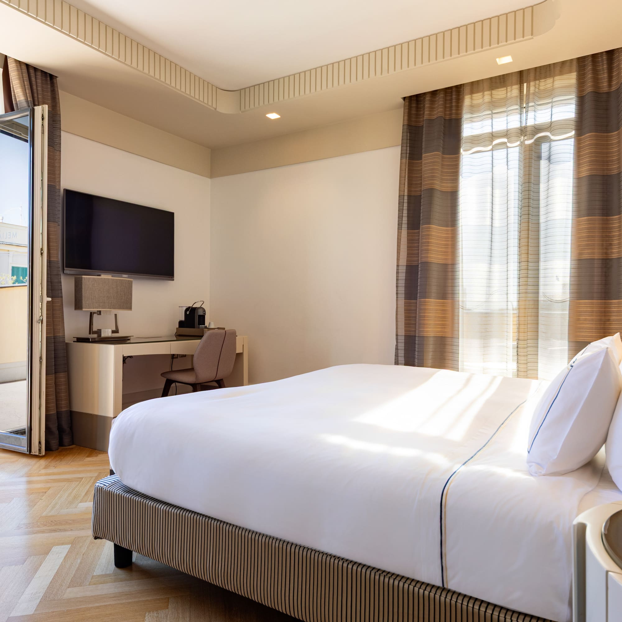 a bedroom with a bed and a desk