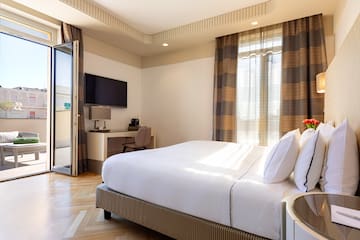 a bedroom with a bed and a desk
