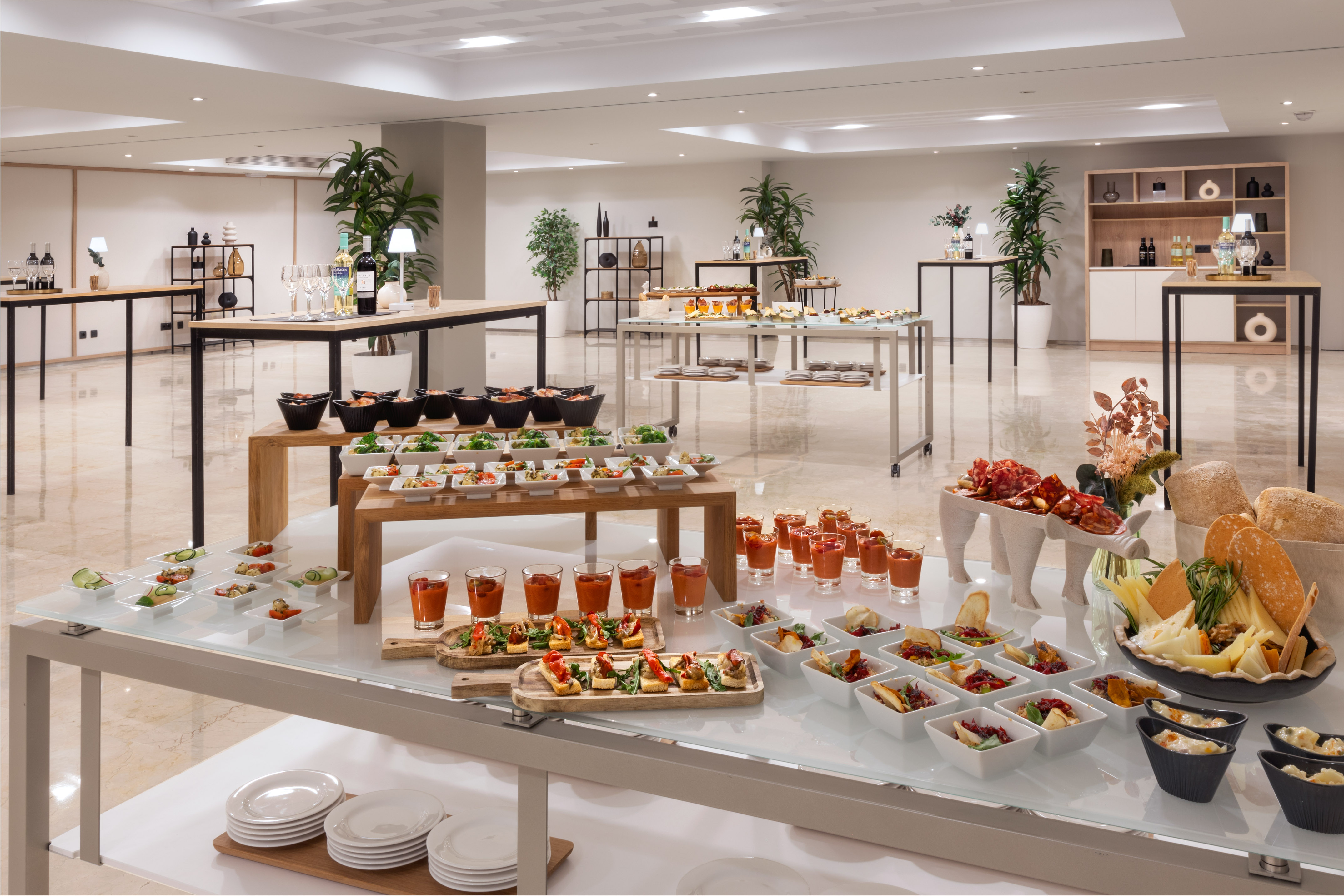 Modern buffet catering: appetizers, salads, charcuterie, and drinks.