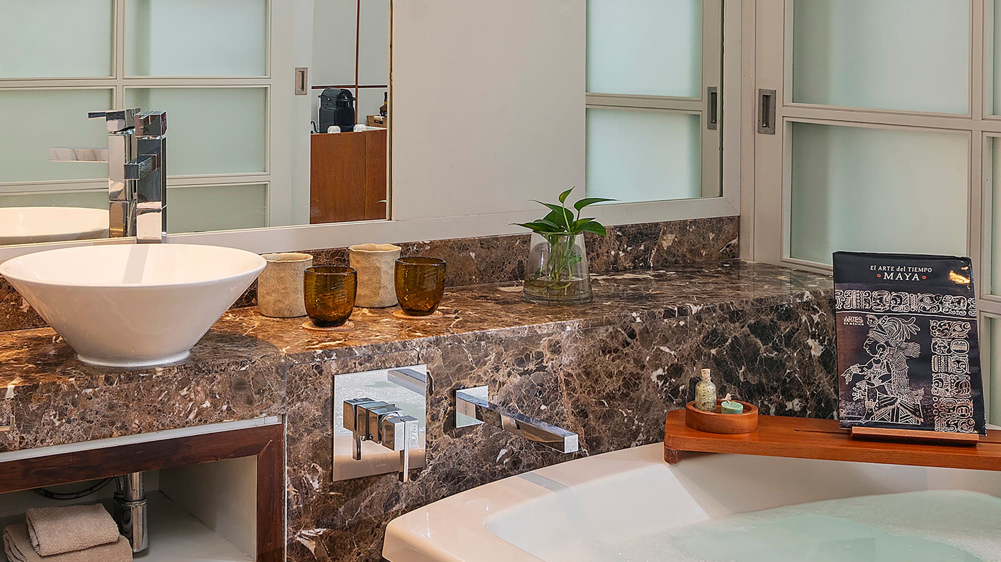 a bathroom with a tub and sink