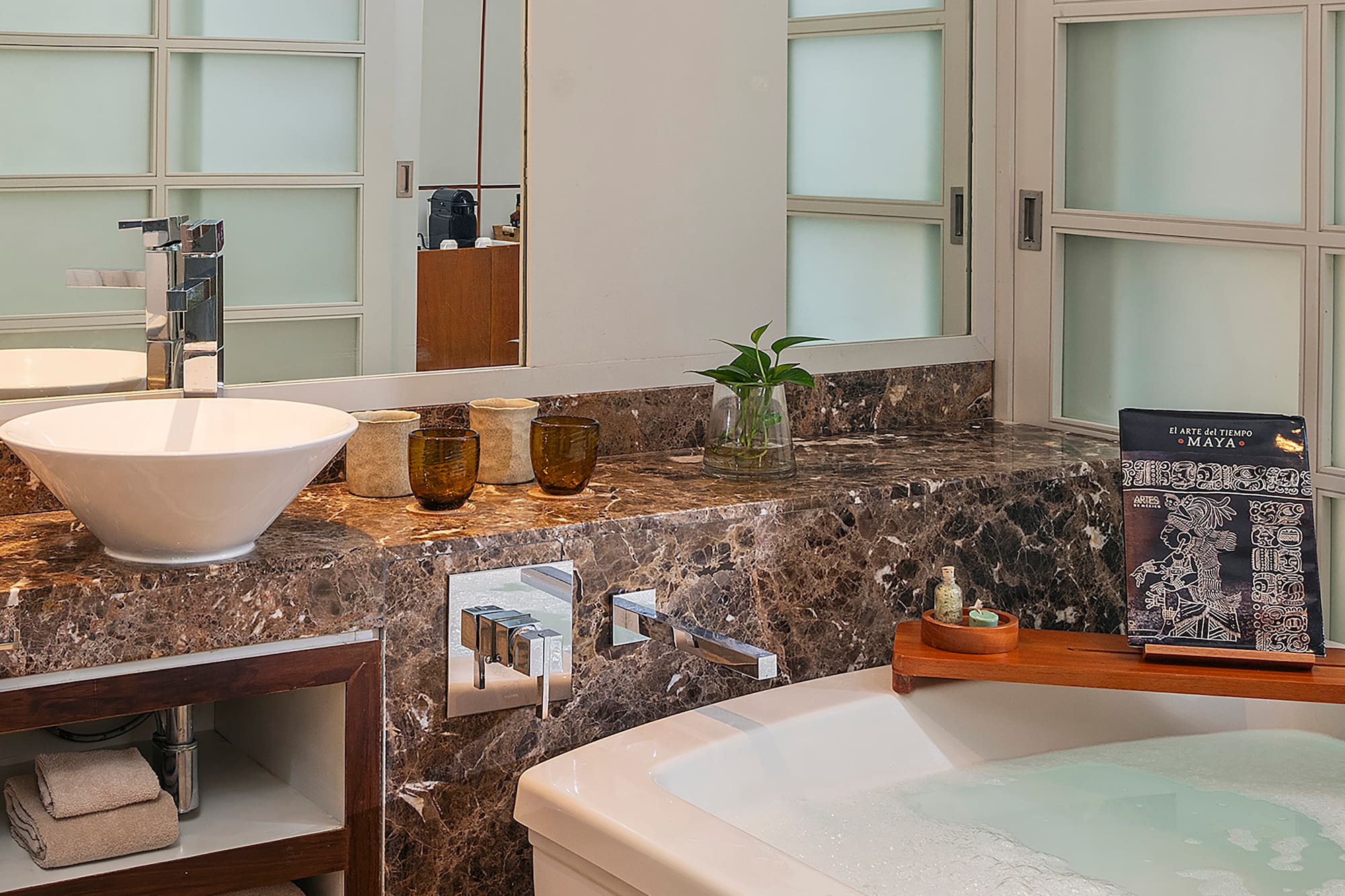 a bathroom with a tub and sink