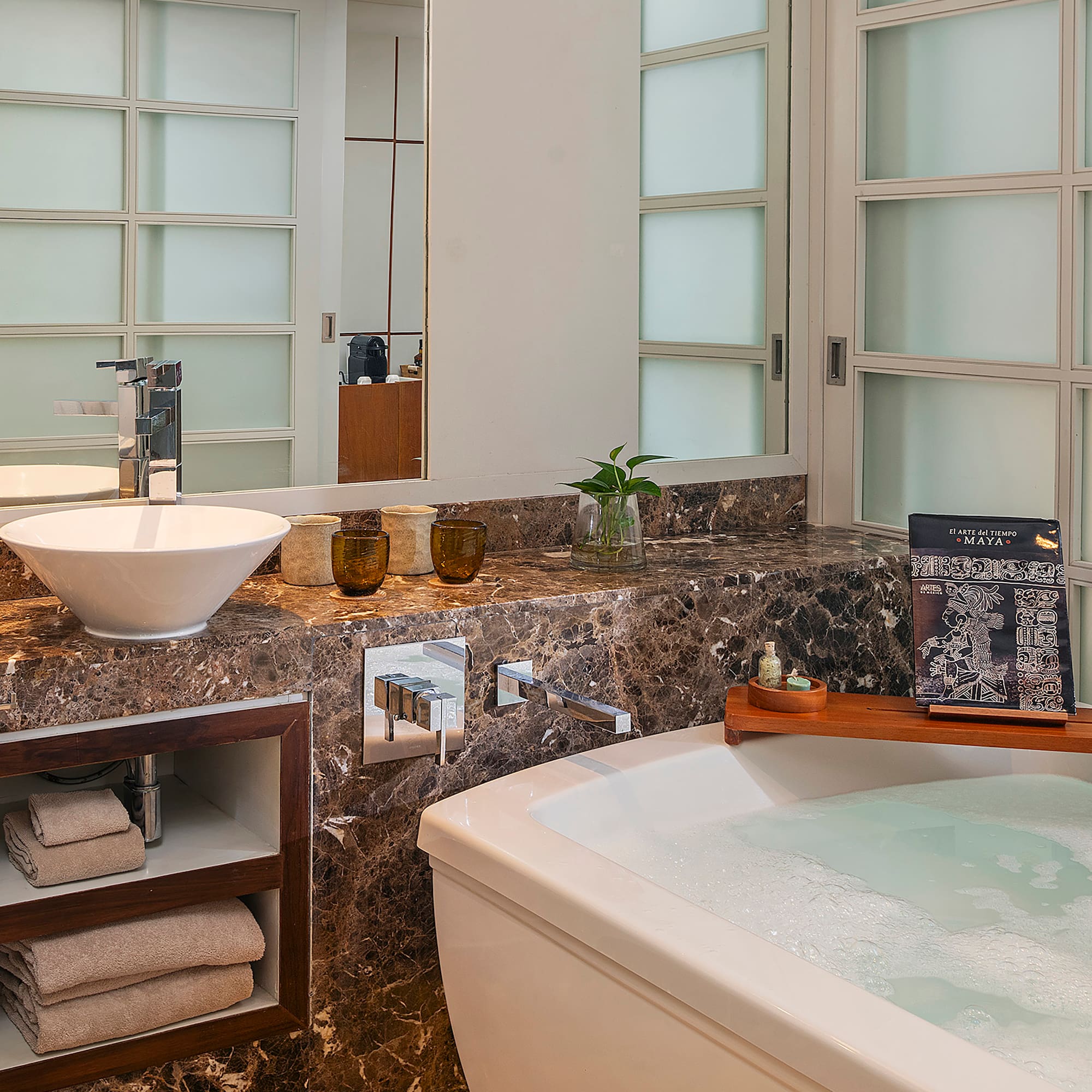 a bathroom with a tub and sink