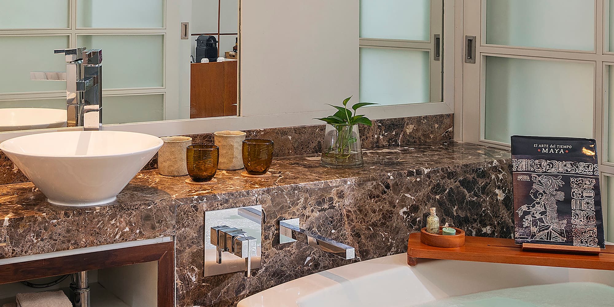 a bathroom with a tub and sink