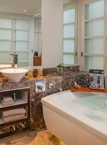 a bathroom with a tub and sink