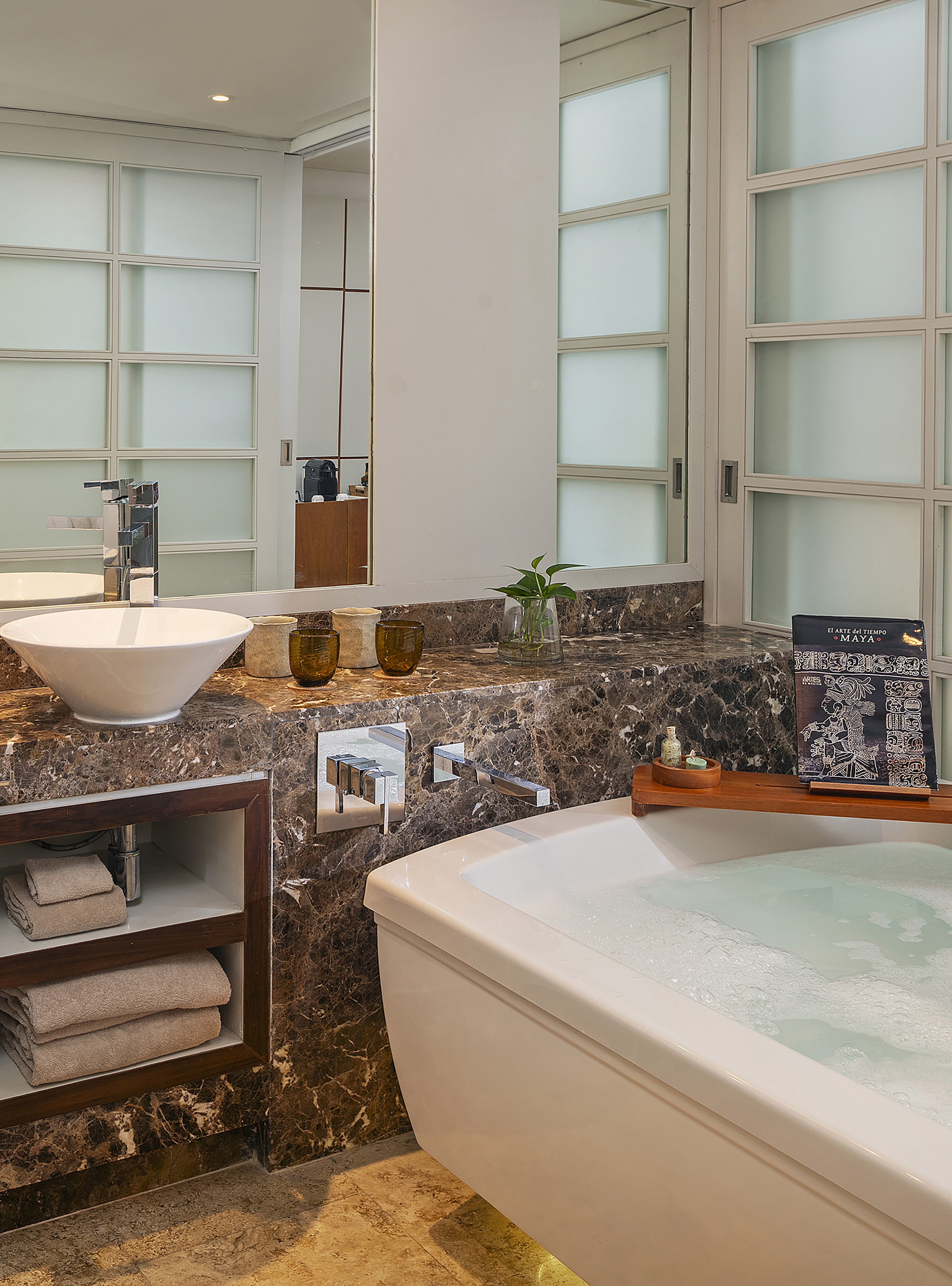 a bathroom with a tub and sink