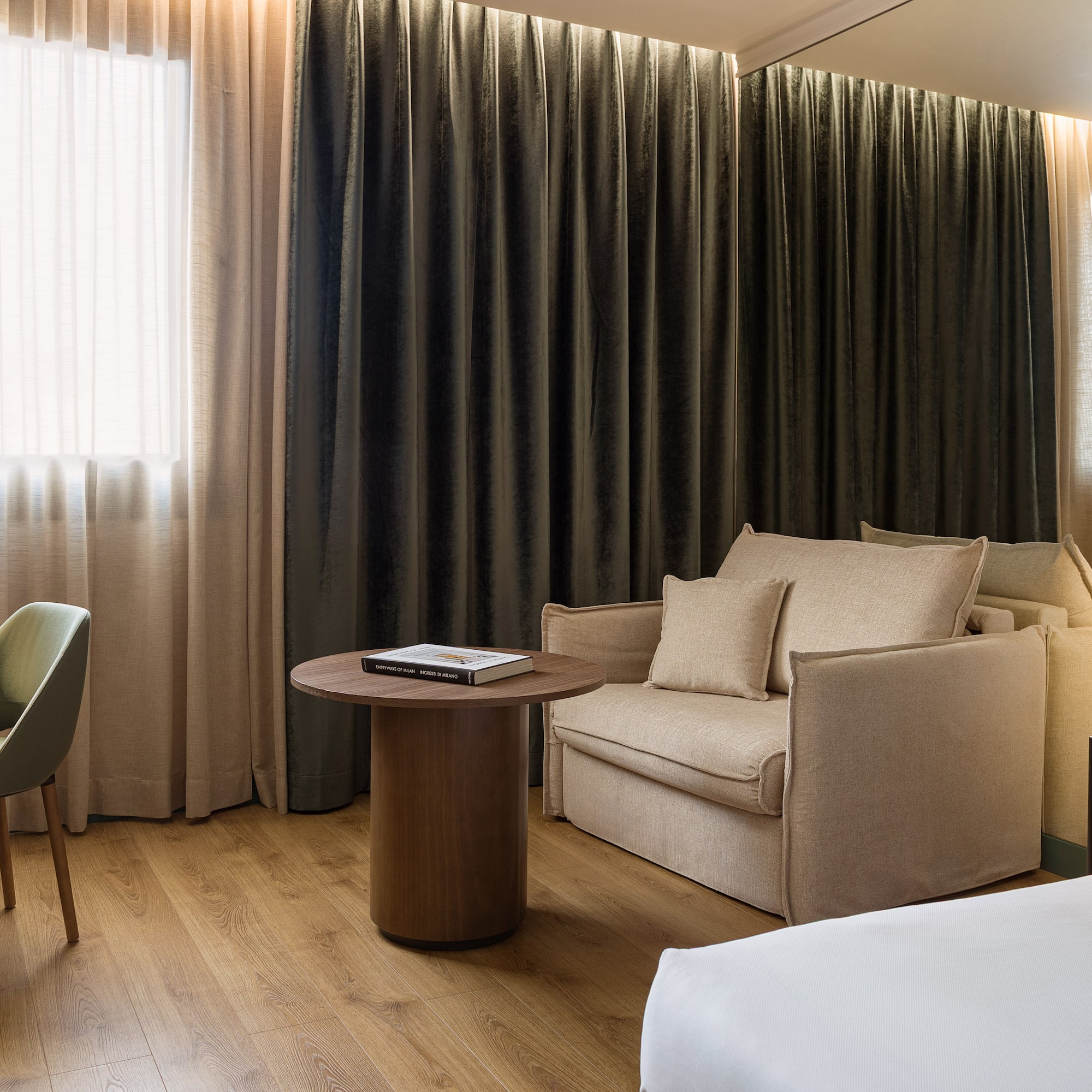 a room with a bed and a chair