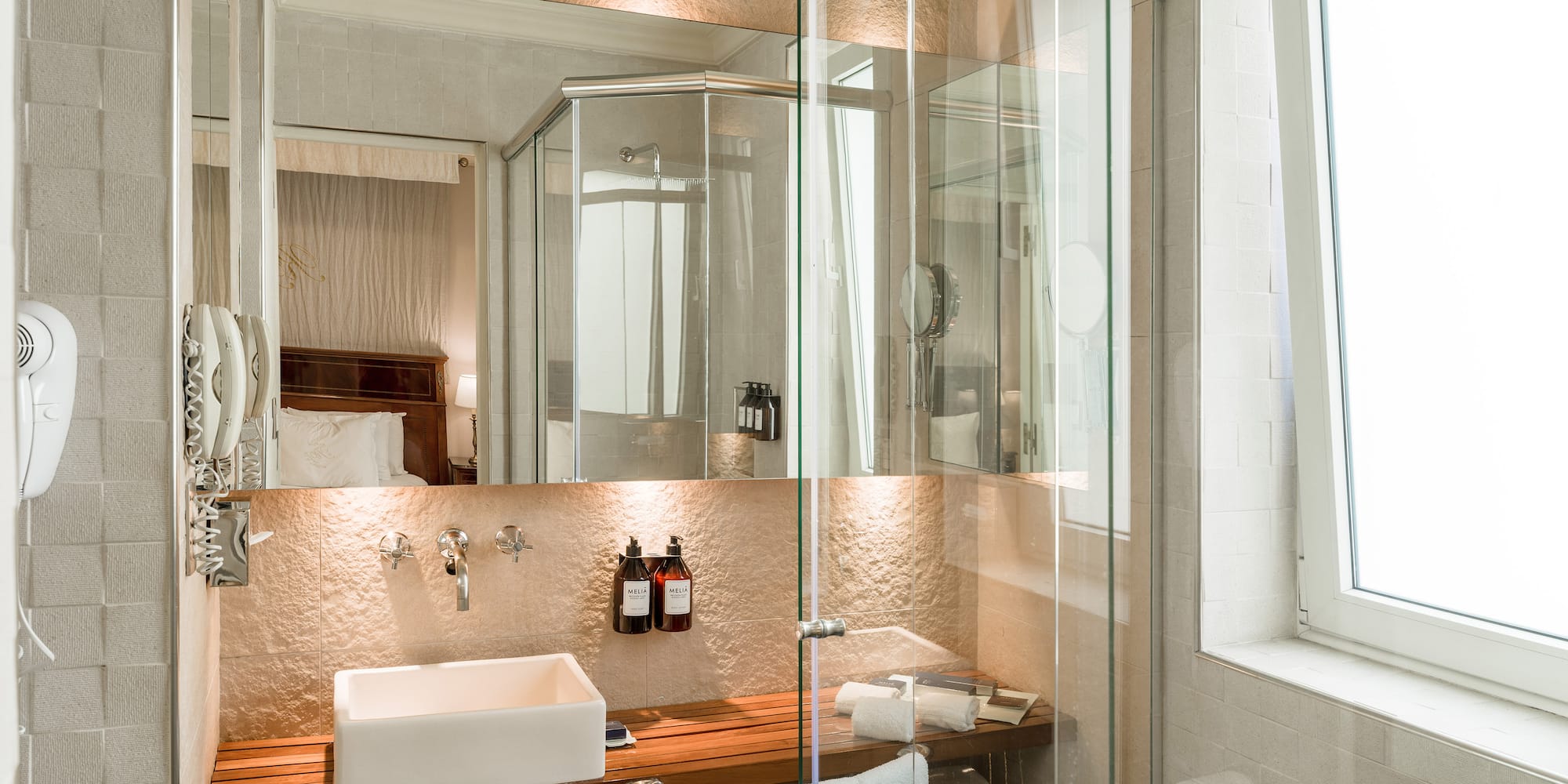 a bathroom with a glass shower door